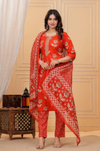 A woman wearing a navy blue handblock printed cotton kurta with a large geometric print dupatta in red, blue, and white.