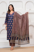 Woman wearing a navy blue cotton kurta with red floral handblock prints, matching zigzag patterned trousers, and a coordinating printed dupatta.