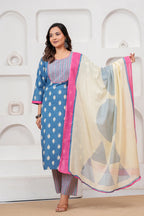 Woman in a blue Jaipur handblock printed cotton kurta with leaf motifs and a designer off-white dupatta with pink borders.
